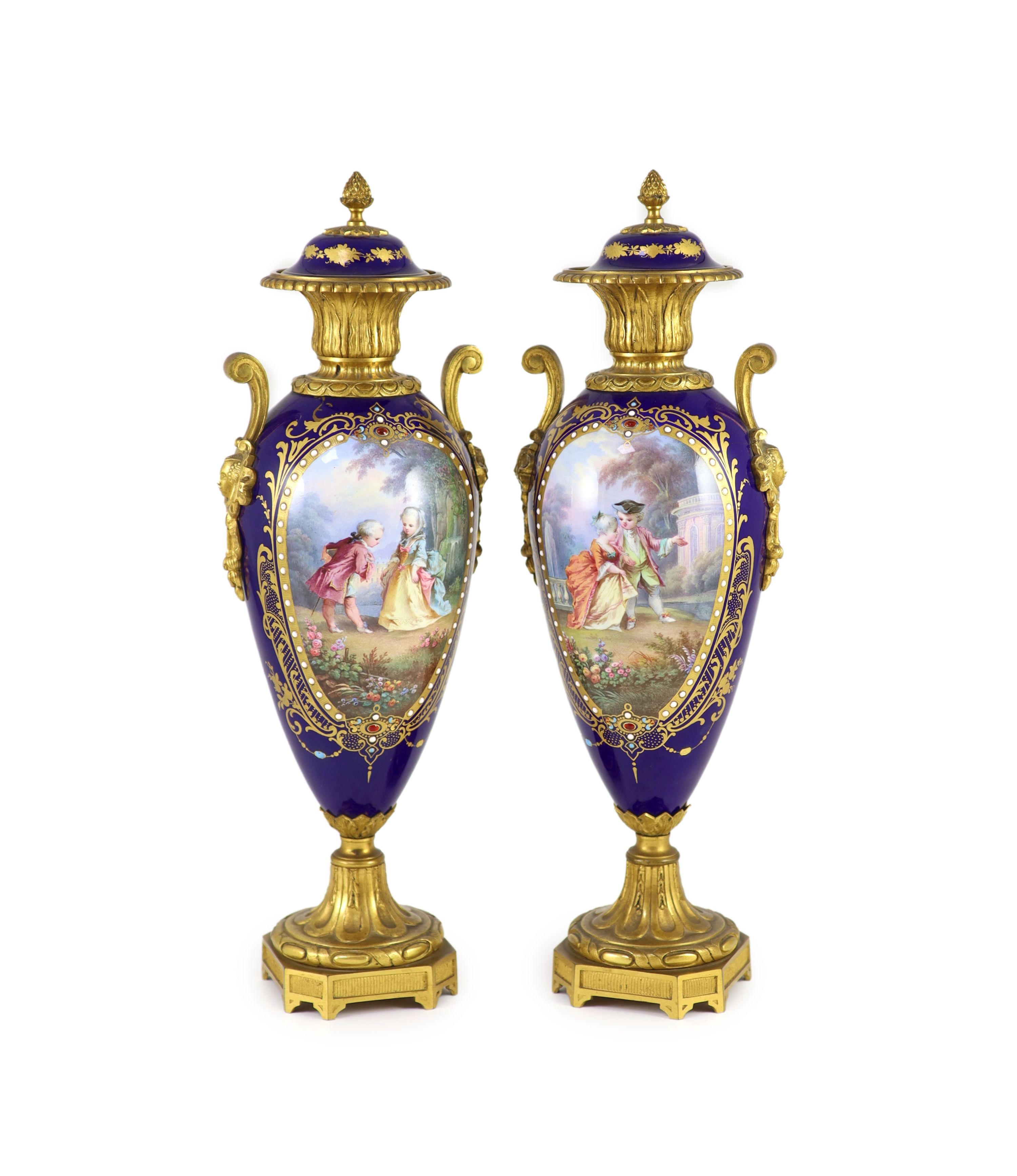 A pair of Sevres style ‘jewelled’ porcelain and ormolu mounted vases, c.1900, 41.5 cm high, one vase cracked